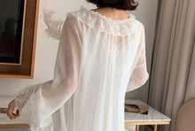Detail of wrap around lace trim on chiffon robe.