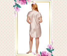 Back view of  Charming nightgown from Shadowline at Margaret Lawton Nightgowns. Shimmering sexy nightshirt in blush or dramatic black has a delicate lace trim that enhances the neckline and dolman sleeves. This sleek, sleepshirt fits comfortably over the bodice and falls at the knee. and feels oh-so silky.