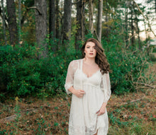 Beautiful woman in front of forest wearing an elegant  white lace short nightgown and robe set.