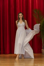 Made with shimmery, silky Satintrique® fabric made in the USA, this beautiful vintage-inspired peignoir from Velrose-Shadowline feels and looks amazing. Lightweight and airy skirt and sleeves, with a beautiful European stretch lace that delicately covers the bust, cuffs, and shoulders. Perfect bridal or trousseau gift. Fits true to US sizes. Best for cup size DD or smaller. Gorgeous and easy to wear. Available from Margaret Lawton in black, red, champagne and shimmery silver.