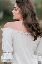 Back view close up of a woman wearing a beautiful ankle length soft cotton nightgown trimmed in soft lace. Can be worn on or off the shoulder. Light, comfy and elegant.