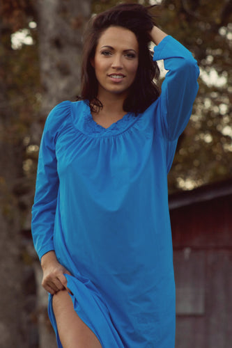  Fun Shadowline® ankle-length nightgown from Margaret Lawton with long sleeves. It's pretty and easy to live in. Vibrant color (blue or orchid) and a sweeping bodice, with a pretty enhanced neckline that's adorned with lovely stitched flowers, this nightgown is a comfortable everyday go-to with a feminine touch to make you feel pretty. If you like layers, it's perfect because it's roomy with a little stretch.