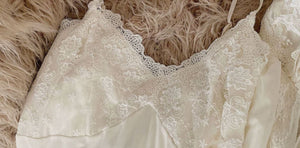 Closeup of the beautiful lace bodice of Margaret Lawton's Romantic White Peignoir. Enjoy the feminine beauty of this vintage style, glamorous white peignoir. It's a perfect gift for yourself or someone special. The gown has adjustable straps with a beautiful lace bodice and a double layered gown. It falls mid-calf. You'll feel uplifted and special, and look angelically alluring as you float gracefully around in these lovely layers of softness.