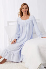 Pretty young lady in a light blue ankle length Eileen West flannel nightgown. Roomy and oh-so-comfortable, made of 100% cotton flannel with beautiful details.  This pretty nightgown is available in XS to a XL and runs large.