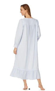 Back view of woman in a light blue ankle length Eileen West flannel nightgown. Roomy and oh-so-comfortable, made of 100% cotton flannel with beautiful details.  This pretty nightgown is available in XS to XL and runs large.