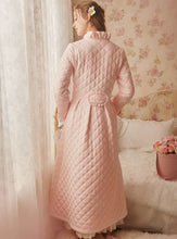 Back view of Margaret Lawton's Warmth. Ruffled cuffs and collar add a feminine touch, and satin bows at the waist and sleeves transform this winter robe into something quite fancy.
