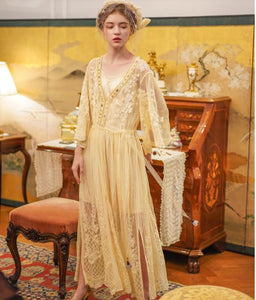 This elegant nightgown is a two-piece set with a lovely silky satin chemise that's worn under a soft, stretchy textured layer of pure golden glamour.  The champagne-colored chemise has adjustable spaghetti straps and falls above the knee. The soft, stretchy overlayer falls low to mid-calf. It's graceful and flowing with three-quarter bell sleeves and waist tie. It's gorgeous ya'll!