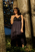 This captivating long nightgown from Shadowline is created in lightweight, silky soft Satintrique® nylon tricot fabric exclusive to Shadowline. The luxuriously soft European stretch lace bodice is designed for a feminine fit without sacrificing comfort. Gentle gathers fall from the waist into a long, flowing skirt with an overlapping tulip hem. The gown has a delicate matching satin bow with tiny seed pearl accents at the center front.