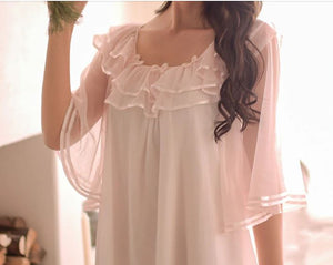 Close up image of gentle chiffon ruffles, trimmed in satin, of the neckline  of dreamy sheer nightgown from Margaret Lawton.  