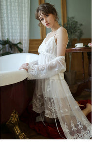 Beautiful woman wearing gorgwous white lacey short nightgown and robe set.