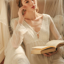 This pretty nightgown is made with two layers of soft fabric with some stretch for comfort. The bodice is lacy with a deep V-neck with a pretty ribbon criss-cross across the front. The sleeves are transparent, soft stretch mesh with lace around the cuffs. So Pretty.