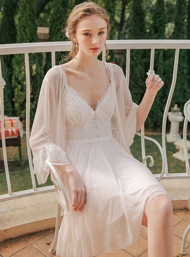 Margaret Lawton Nightgowns beautiful chiffon set includes an elegant robe and thigh-length gown. With gracefully layered chemise featuring lace, buttons, and a stunning bow, this set is sure to make a lasting impression.