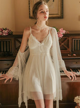 Margaret Lawton Nightgowns beautiful chiffon set includes an elegant robe and thigh-length gown. With gracefully layered chemise featuring lace, buttons, and a stunning bow, this set is sure to make a lasting impression.