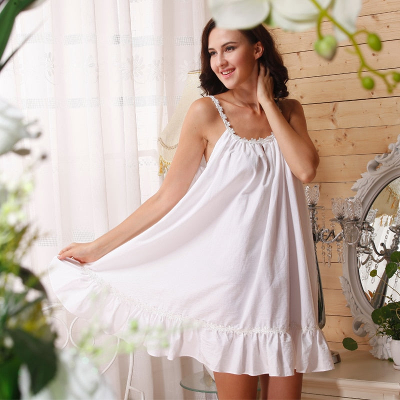 This darling, short, sleeveless nightgown from Margaret Lawton is made with all-cotton fabric that has a delightful feel. The straps and round neckline are trimmed with sweet white flower embroidery which also trims the the ruffled hem. It's so flirty and sweet you'll love wearing it.