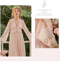 This elegant peignoir is the ultimate in feminine grace. The transparent robe features a gorgeous, embroidered bodice punctuated by three pearl buttons and a beautiful ruffle. The robe is a simple design of soft material, with spaghetti straps and deep v-neck trimmed with soft scalloped lace. 