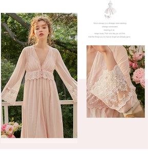 This elegant peignoir is the ultimate in feminine grace. The transparent robe features a gorgeous, embroidered bodice punctuated by three pearl buttons and a beautiful ruffle. The robe is a simple design of soft material, with spaghetti straps and deep v-neck trimmed with soft scalloped lace. 